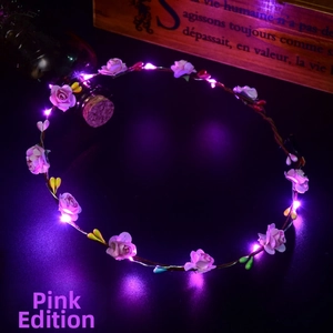 Detailed macro view of a luminous pink floral LED headband wreath with rose petals