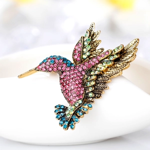 Exquisite hummingbird brooch featuring colorful rhinestones on vintage gold metal alloy