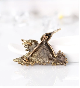 Detailed back view of vintage gold hummingbird brooch showing secure pin clasp mechanism