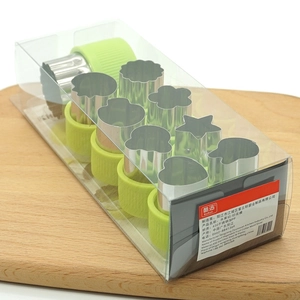 9-piece stainless steel vegetable and fruit cutter set with green handles in a clear box