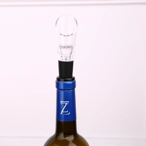 Stainless steel wine pourer and stopper inserted in bottle for quick decanting