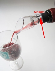 Detail of stainless steel wine aerator pourer showing the air inlet for fast decanting