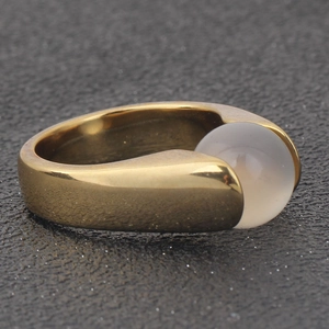 Detail view of 18K gold plated stainless steel ring featuring a grey cat's eye gemstone