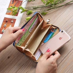 Internal layout of long navy wallet showing card slots and large capacity compartments