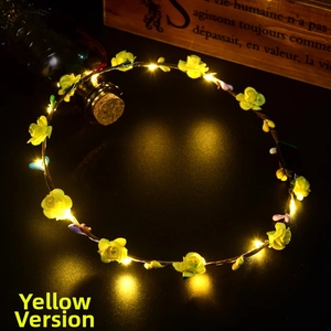 Detail of warm LED light string on artificial yellow rose headband for glowing night hair accessories