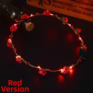 Detail of red floral LED headband showing luminous petals and battery compartment