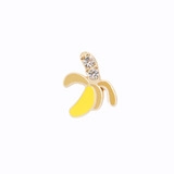 Detailed macro view of a golden banana stud earring with yellow enamel and small diamonds