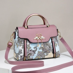 Sac à main bandoulière en cuir violet avec imprimés floraux et boucle en métal cygne