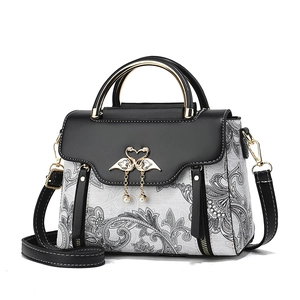 Sac à main vintage pour femme avec motif paisley, poignées noires et fermoir cygne