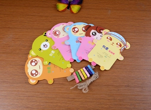 Macro view of colorful DIY cartoon paper photo frames with mini wooden clips and twine