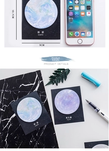 Close-up of planet-themed sticky notes with realistic Earth and Pluto landscape patterns