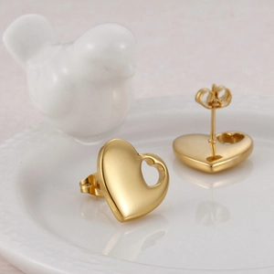 Polished 18K gold plated heart stud earrings for women with minimalist cutout design