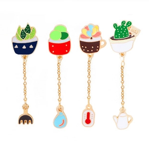 Set of four succulent enamel pins with gold metal finish and hanging garden tool charms
