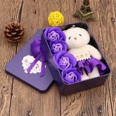 Detail of purple soap rose gift set with a plush bear in a metal heart-shaped box