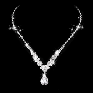 Sparkling silver bridal necklace set with teardrop zircon crystals on black background