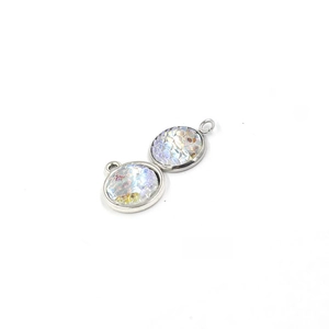 Macro detail of 12mm round fish scale resin pendants with AB color plating for DIY jewelry