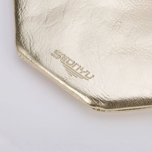 Lip-shaped PU leather coin purse with embossed logo and elegant gold metallic texture