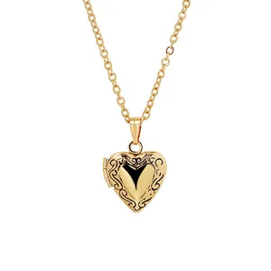 Golden heart-shaped photo locket necklace featuring intricate scrollwork engravings