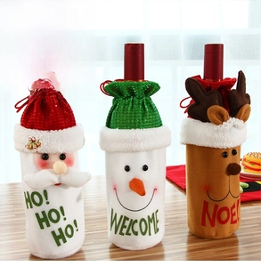 Detail of Christmas wine bags with Santa, Snowman and Reindeer characters on wooden surface