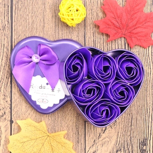 Detail of purple heart-shaped metal tin with six soap roses and a romantic greeting card