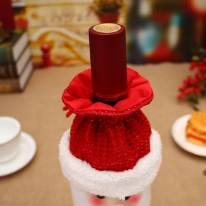 Christmas wine bottle cover featuring Santa Claus design on a plaid plush decorative bag