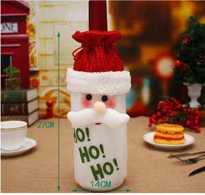 Detailed view of Santa Claus wine bottle cover with HO HO HO text and 27x14cm measurements