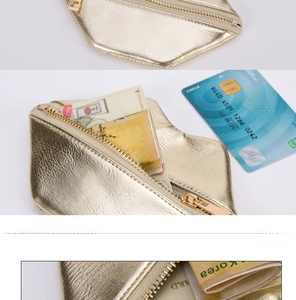 Detail view of mini lip-shaped coin purse showing gold zipper and card storage