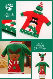 Close-up of Christmas wine bottle covers featuring red snowman and green elk designs