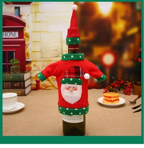 Detailed view of red knitted Christmas wine bottle cover with Santa Claus embroidery