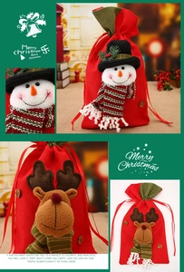 Detailed view of linen Christmas drawstring gift bags featuring 3D snowman and elk dolls