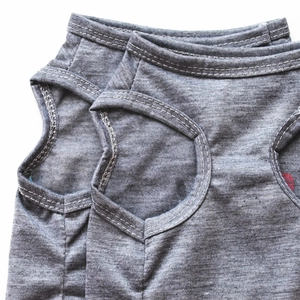 Detail of grey knitted pet vest showing high-quality stitching on collar and armholes