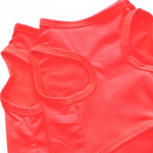 Detail view of double-stitched seams on vibrant orange pet knit vest for dogs