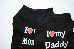 Detail of black pet vests featuring I love Mom and I love my Daddy heart prints