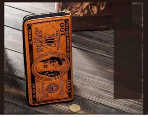 Macro detail of long zip-around wallet featuring vintage 100 US dollar bill pattern print