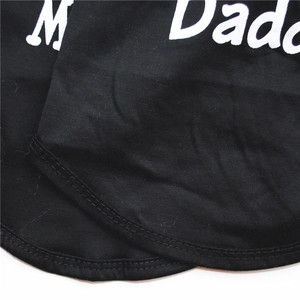Close-up detail of black cotton pet vest with white Daddy print and stitching