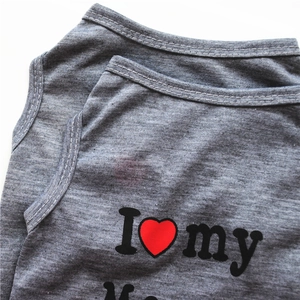 Detail of grey knitted pet vest showing high-quality stitching and I love my heart print