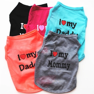 Detailed flat lay of colorful cotton pet vests featuring I love my Mommy and Daddy slogans