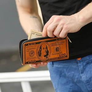 Retro brown long zipper wallet with 100 dollar bill print held by hand showing storage