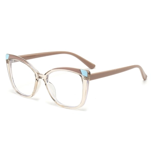 Cat eye TR90 glasses frame in champagne with blue accents and brown temples on white background