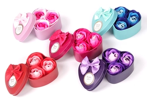 Set of five colorful heart-shaped soap flower gift boxes with ribbons and Sweet Love tags