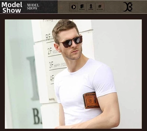 Close-up of a long men's wallet with vintage US dollar print held by a male model outdoors