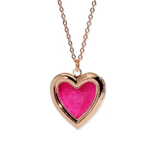 Rose gold heart-shaped floating locket necklace featuring a sparkling pink glitter inlay