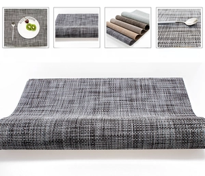 Detail of woven vinyl table mat showing thick texture and heat-resistant grey fibers