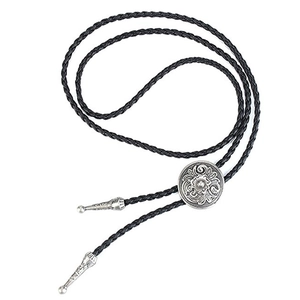 Detail of silver floral engraved slider and metal tips on a black braided bolo tie