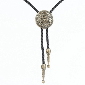 Vintage Celtic pattern bolo tie with antique bronze floral relief on black braided rope