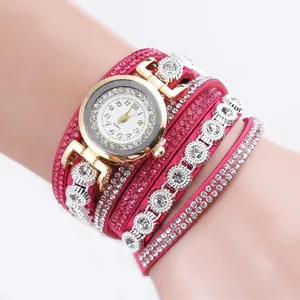 Macro view of rose red multi-layer leather strap watch with sparkling crystal accents