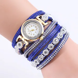 Blue wrap-around leather watch with sparkling rhinestones and a gold quartz dial detail