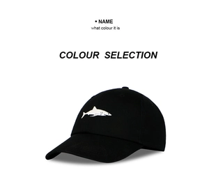 Detail shot of a black cotton baseball cap featuring white shark embroidery pattern