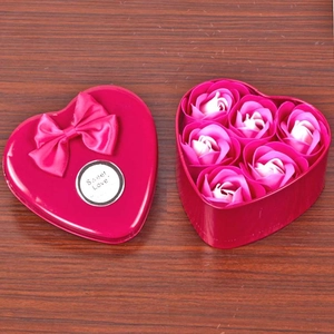 Pink heart-shaped metal gift box with six pink soap roses and a Sweet Love ribbon