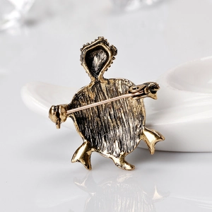 Detailed back view of vintage turtle brooch in antique bronze finish with pin clasp